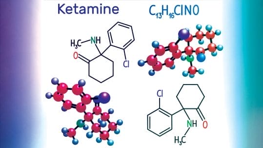 Person experiencing ketamine therapy lying peacefully in a relaxing, softly lit treatment room.